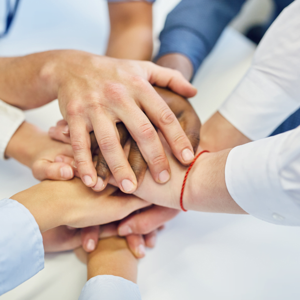 Picture of a team bonding over team building activities to represent the power of serious games in team building exercises