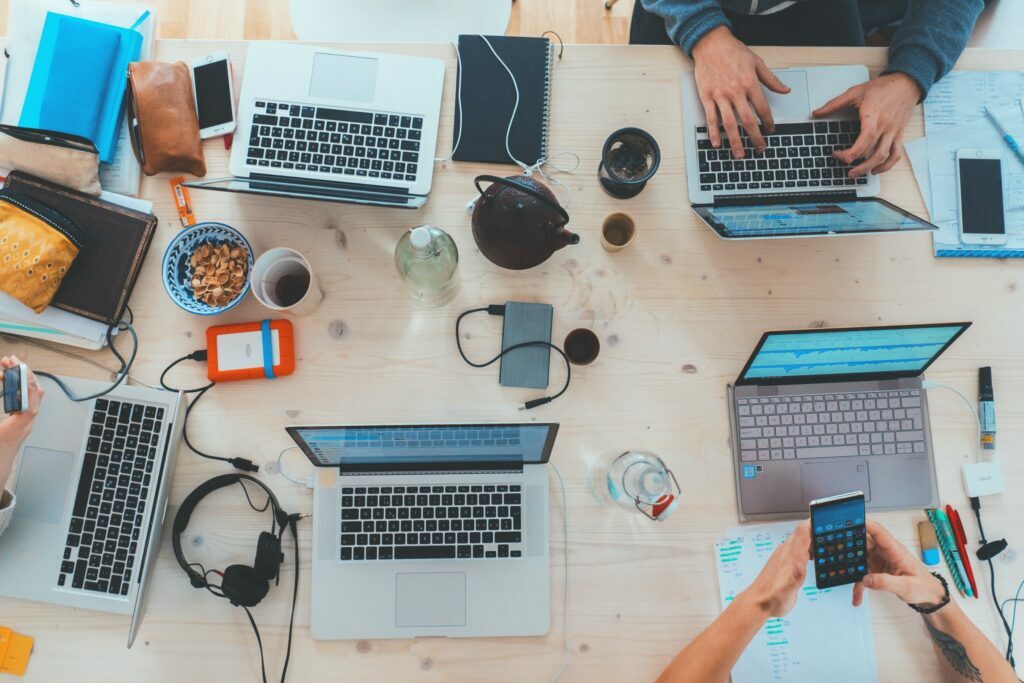 Picture of computers in an office to represent group training of the top 10 skills for 2025 with simulation training