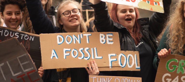 Picture of a climate change protest to illustrate the blog piece on business sustainability turning ESG talk into action.